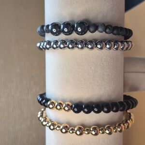Four Braclets- 2 Sets Size 7 Black Onyx, Gold Hemitate, Volcanic & Hemitate,